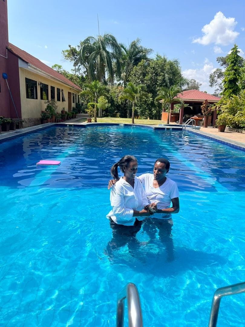 Valentino Kamya conducting a baptism in the water