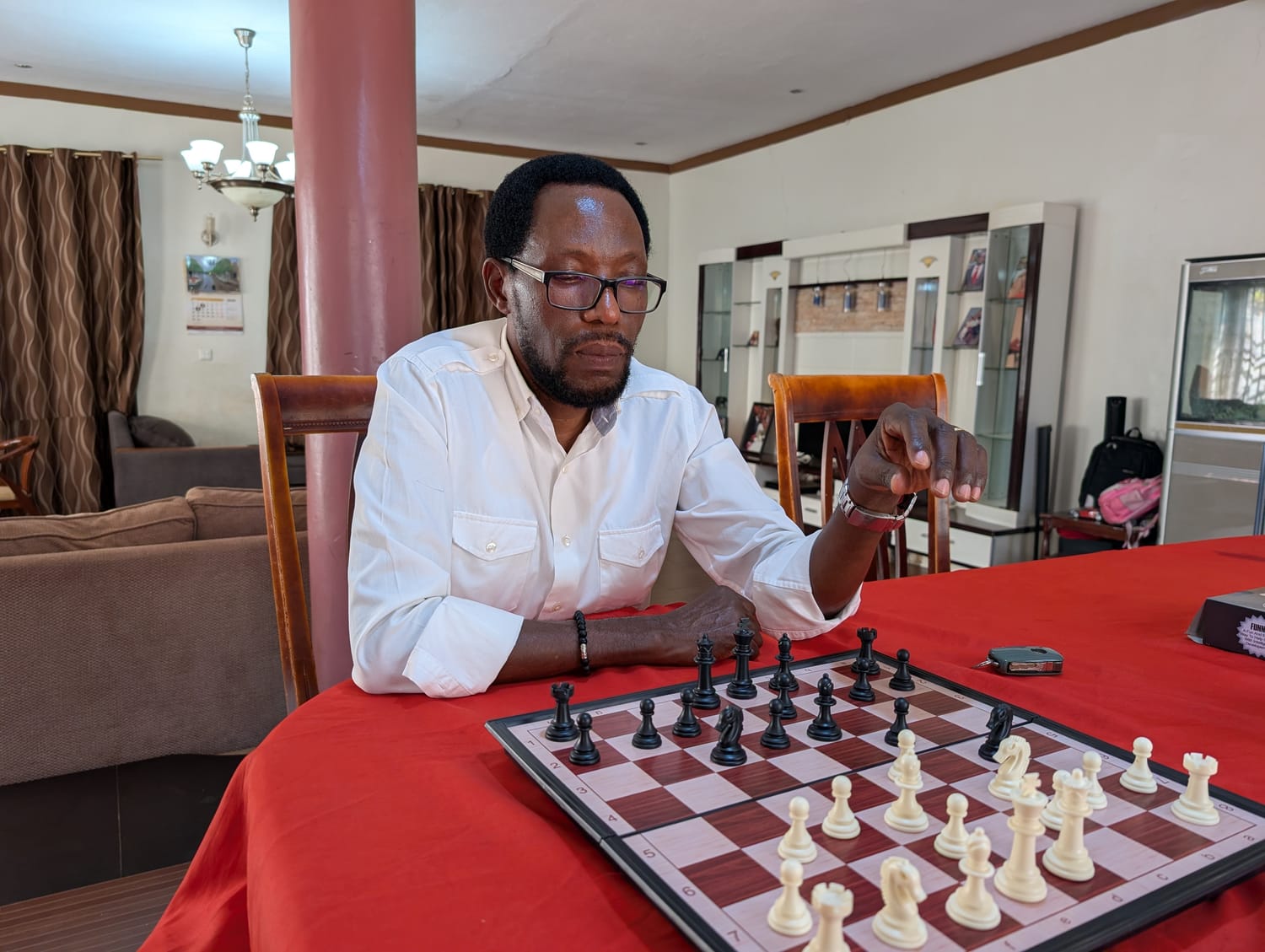 Valentino Kamya playing a game of chess