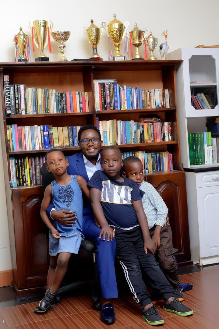 Valentino Kamya with his three children