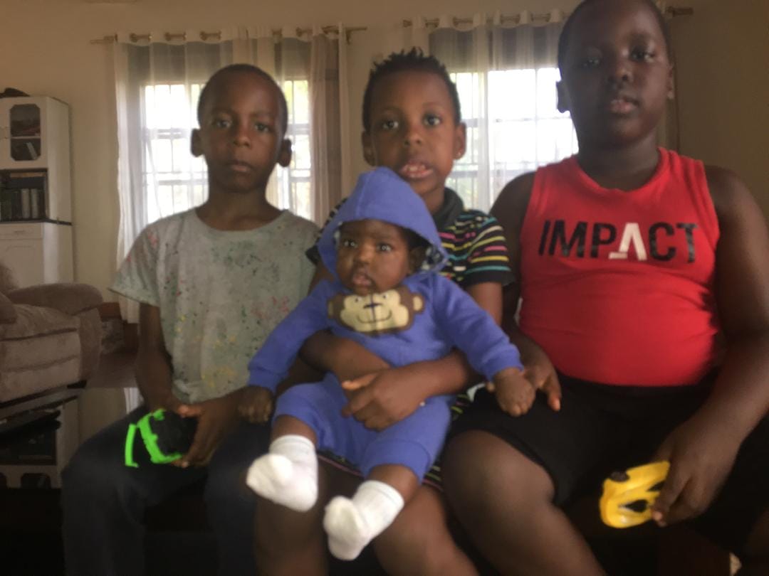 The three children of Valentino and Lydia Kamya